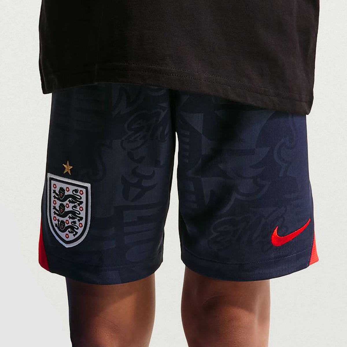 England 2026 away kids kit, KANE 9 - matching kids shorts worn by a model, front