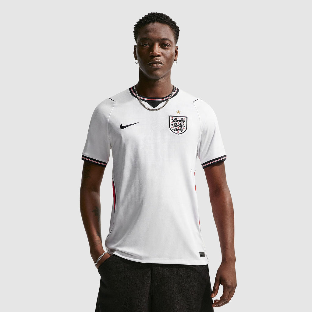 England 2026 home fan shirt, KANE 9 - front view of the base shirt worn by a model