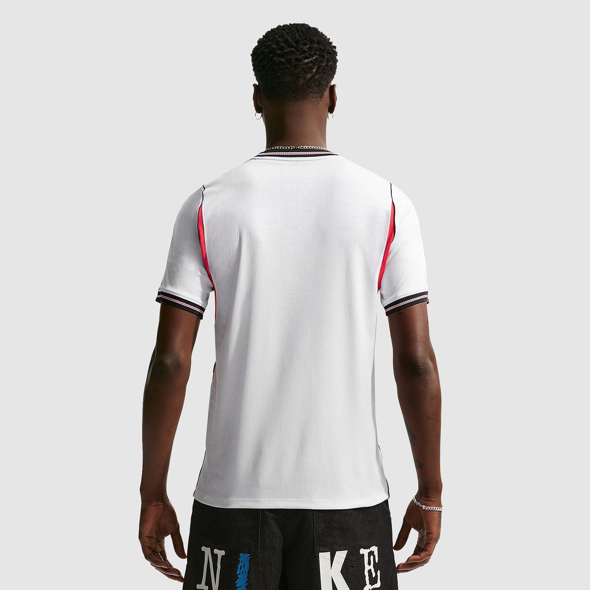 England 2026 home fan shirt, KANE 9 - back view of the base shirt worn by a model