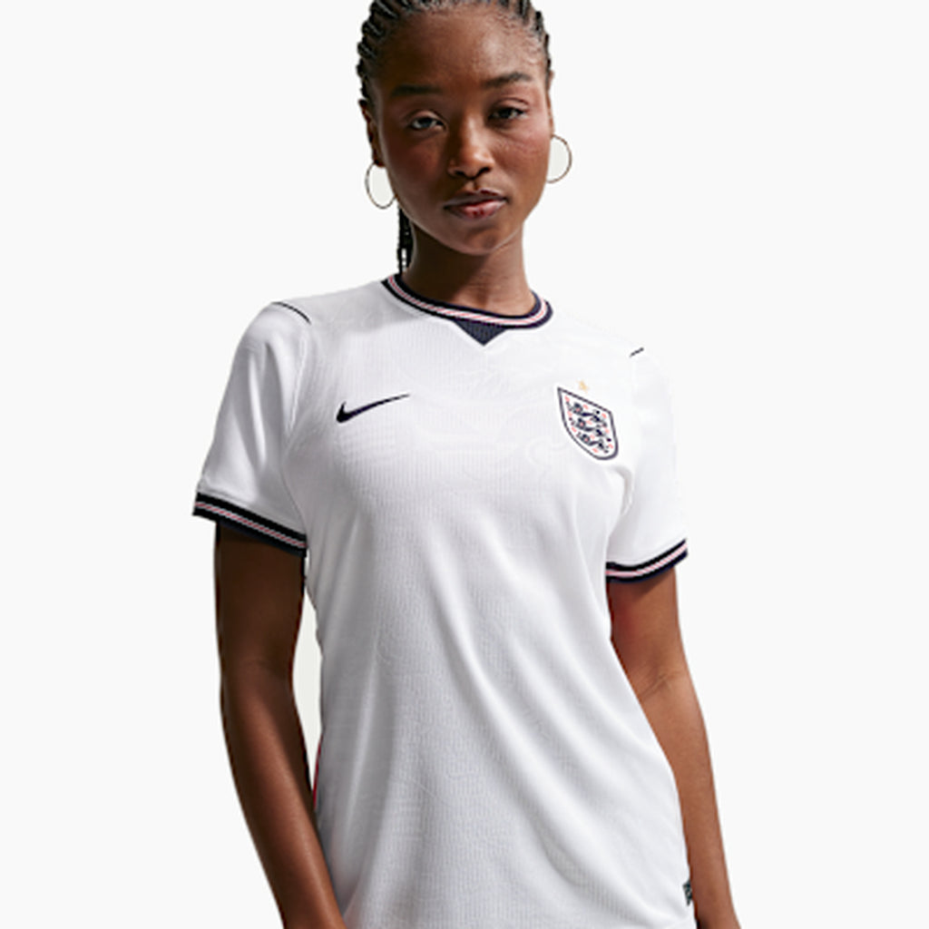 Woman wearing the England 2026 home shirt — base shirt front