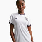 Woman wearing the England 2026 home shirt — base shirt front